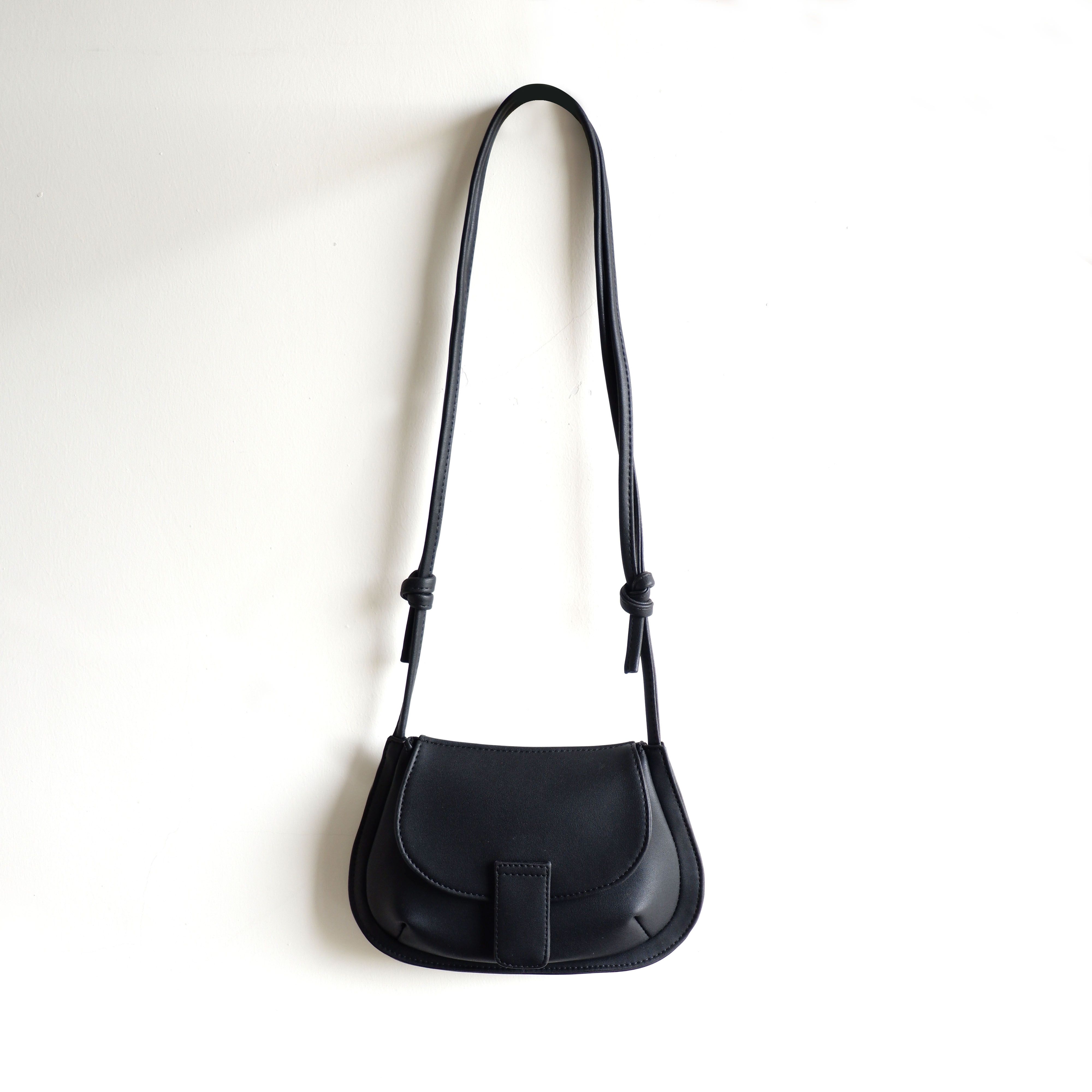 Shop Black Horseshoe Crossbody Bag by  | Sift & Pick